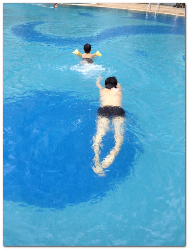 father and son swimming