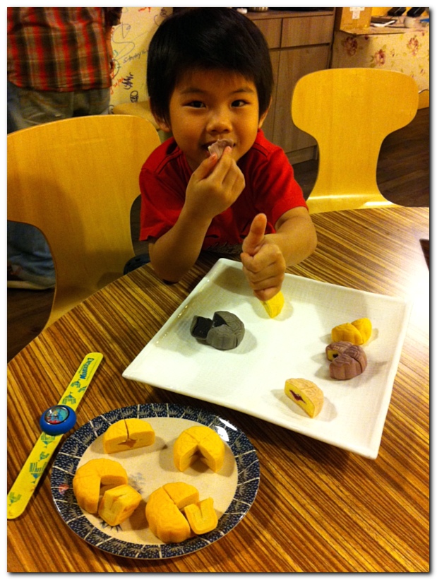 Ethan eating Mei-Xin mooncakes