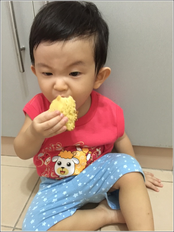 Ayden eating rice cooker cake