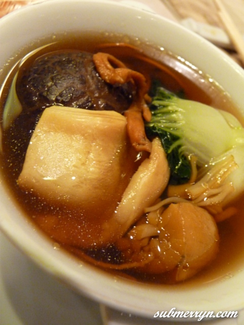 Double boiled chinese herbal soup with chicken, fish maw and dried scallops